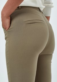 Minus MICARMA FLARED PANTS - Broek - mineral gray