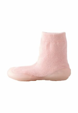 Rosa Socke mit einem gerippten Strickoberen und einer glatten, abgerundeten, gummiartigen Sohle, die ein nahtloses Design für zusätzlichen Komfort bietet.