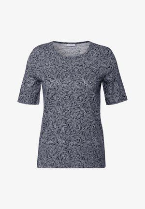 Haut à manches courtes marine avec un motif géométrique blanc, col rond et tissu doux et texturé. Coupe décontractée sans fermetures visibles.