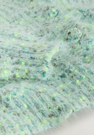 Texturiertes, hellblaues Strickgewebe mit flauschigen Fasern und Sprenkeln von Gelb und Braun; zeigt ein lockeres, luftiges Webmuster.