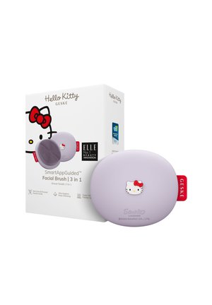 Hello Kitty facial brush in light purple, featuring a soft silicone surface and a cartoon character design. Box includes product details and logos.