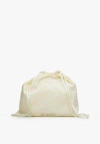 Drawstring bag made of cream cotton fabric. Features a gathered top with two coordinated ribbon straps. Includes subtle logo detail at the base.