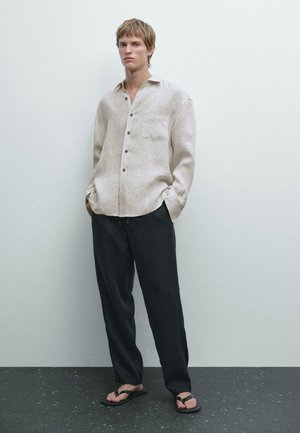 JOGGER - Pantaloni - black