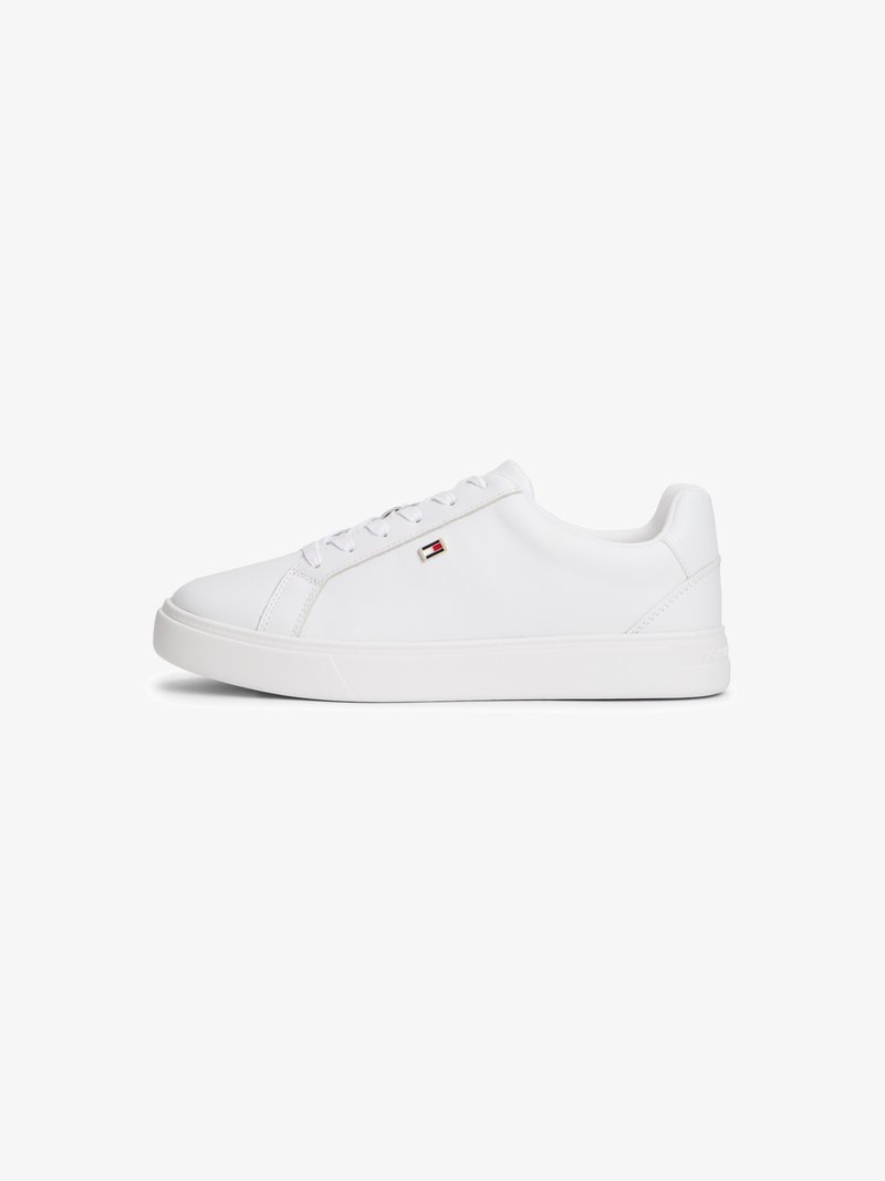 White sneakers made of smooth synthetic material, featuring a rounded toe, flat sole, and minimalistic design with a small logo accent.