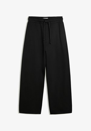 Schwarze weit geschnittene Sweatpants mit elastischem Bund, Kordelzug und Seitentaschen; aus weichem, strukturiertem Stoff hergestellt.