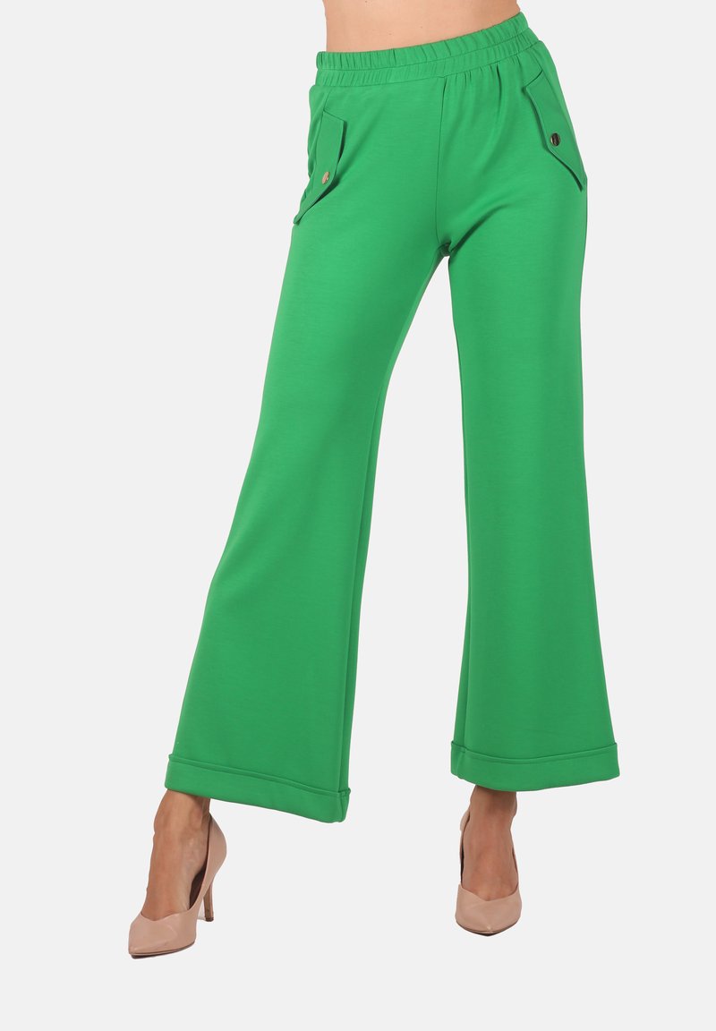 Green wide-leg pants made from soft fabric, featuring two side pockets with decorative buttons and a comfortable elastic waistband.