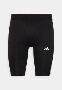 Schwarze Sportshorts mit eng anliegendem Schnitt, aus glattem Material gefertigt. Mit einem weißen Logo auf der unteren rechten Seite und einem elastischen Bund.
