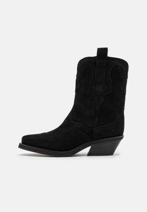 Black suede cowboy boot featuring decorative stitching, pointed toe, 2-inch block heel, and pull tab at the back for easy wear.