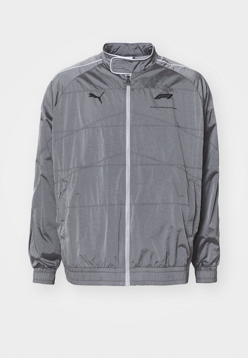 Gray, lightweight zip-up jacket with a high collar. Features elastic cuffs and hem, textured panels, and a black logo on the chest.