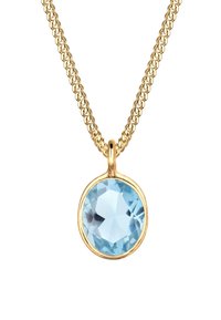 Guldsnørret halskæde med en rund, facetteret lysblå ædelsten pendant indkapslet i en glat guldbeslag på en vævet kæde.