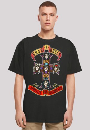 Schwarzes Baumwoll-T-Shirt mit einem bunten Grafikdesign von Totenköpfen und einem Anker, ergänzt durch den Text "Guns N' Roses Appetite For Destruction".