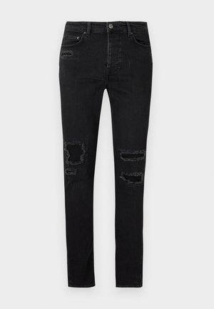 Schwarze Jeans aus Denim mit schlanker Passform, die an den Knien ausgefranste Risse, tonale Nähte und einen klassischen Knopf- und Reißverschluss haben.
