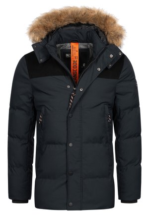 Marineblaue Puffy-Jacke mit gefütterter Kapuze aus Pelz, Reißverschluss und Druckknöpfen, schwarzen Kordstoff-Akzenten und zwei vorderen Reißverschlusstaschen.