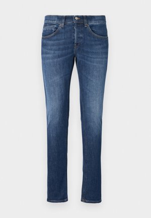 Blå denim jeans med lige pasform, fem lomme-design og lynlåse med knaplukning. Let falming og kontraststing detaljer.