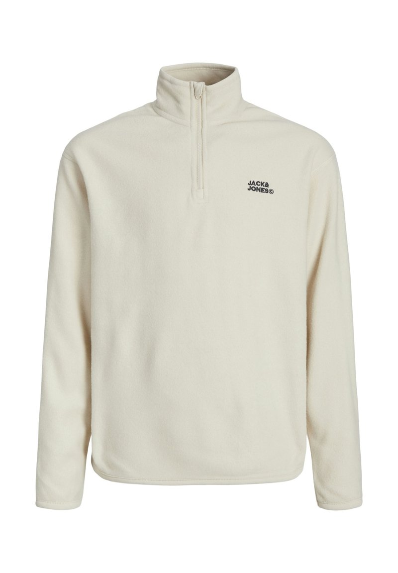 Pullover in pile crema con colletto alto e zip a metà, con logo nero sul lato sinistro del petto. Texture liscia e vestibilità comoda.