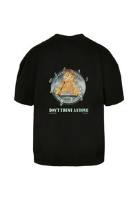 Black cotton t-shirt featuring a large graphic of flames, a pyramid, and dollar signs with the text "DON'T TRUST ANYONE" at the bottom.
