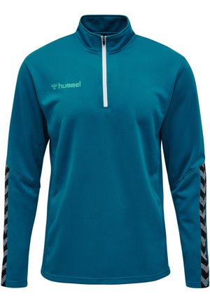 Turkusowy polar z ćwierć zamkiem wykonany z teksturowanej tkaniny, z czarno-białymi chevronowymi akcentami na rękawach oraz małym logo na klatce piersiowej.