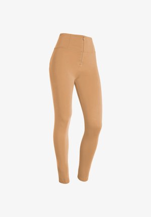 Leggings beiges taille haute avec une texture lisse et un zip à l'avant. Design ajusté allant jusqu'aux chevilles.