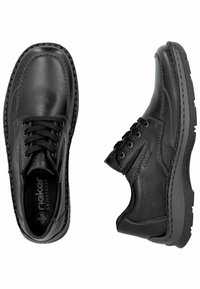 Chaussures en cuir noir avec accents cousus, un design à lacets, des panneaux latéraux texturés et une semelle rembourrée pour le confort. Caractéristique antistress notée.