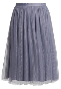 Gonna in tulle di un delicato colore lavanda con vita arricciata. Presenta un motivo a pois e una sovrapposizione semi-trasparente, che termina sopra la caviglia.