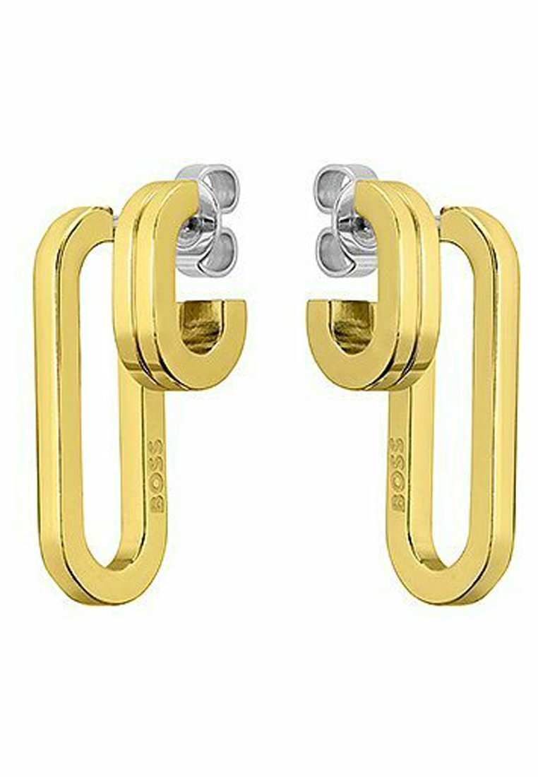 Orecchini in metallo dorato con un design geometrico moderno, caratterizzati da una forma ad anello e accenti argento nella parte superiore. Logo del brand visibile.