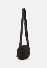 Tommy Jeans ESSENTIAL DAILY CROSSOVER UNISEX - Keresztpántos táska - black