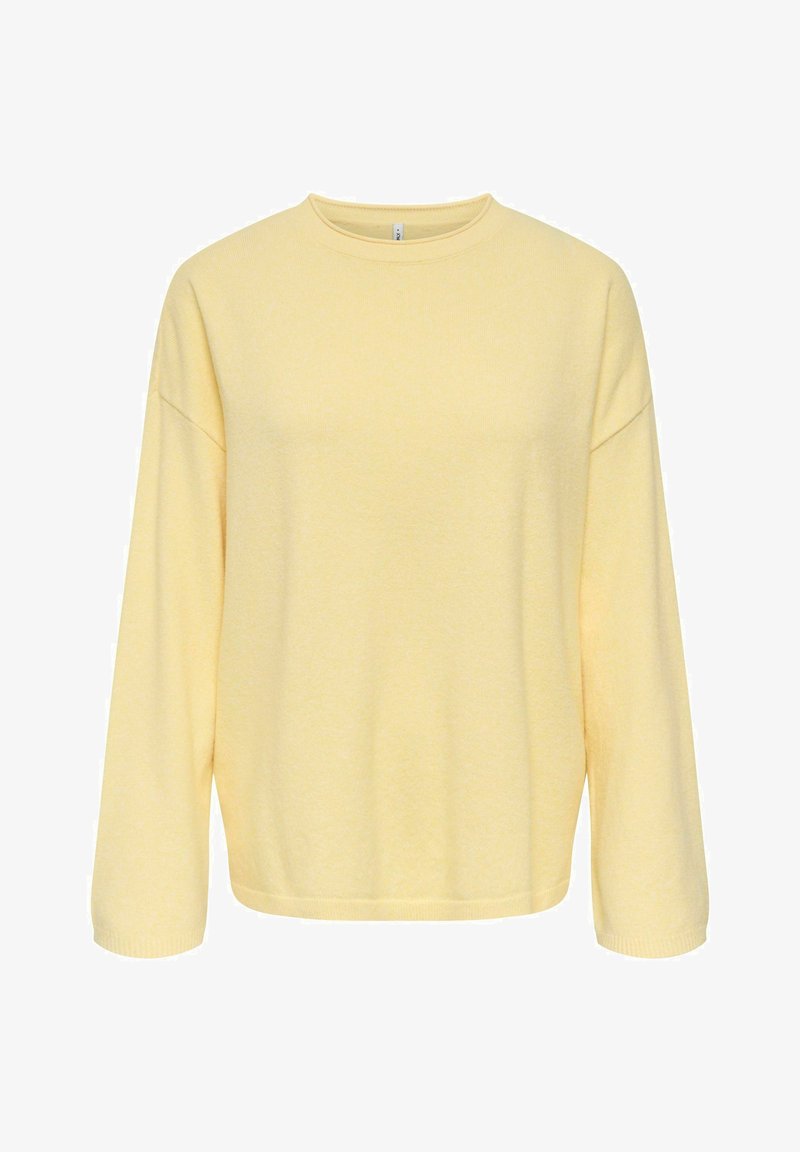 Pull-over jaune en tissu doux, avec un col rond, des épaules tombantes et des manches longues avec des poignets côtelés.