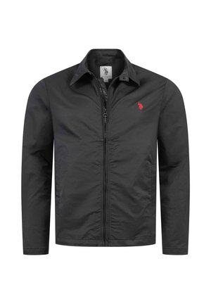Black zip-up jacket with collar, long sleeves, side pockets, and small red embroidered logo on left chest.