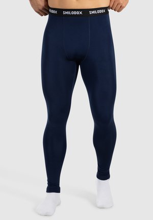 Leggings bleu marine avec une texture lisse, une coupe ajustée et une taille élastique noire arborant le logo "SMILODOX".