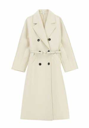 Cappotto doppiopetto beige con grandi bottoni neri, ampi rever e cintura in vita. Tessuto strutturato, cuciture sulle spalle fino alle maniche a lunghezza gomito.