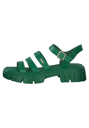 Green chunky sandals featuring multiple wide straps, a buckled ankle strap, and a thick, treaded sole for enhanced traction.