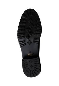 Suola di scarpa in gomma nera con battistrada testurizzato, motivi a diamante e accentuazioni per la presa. Taglia 38 indicata sulla superficie.