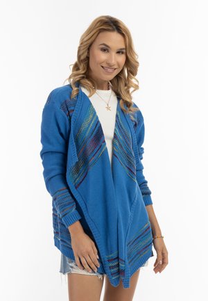 Cardigan blu con apertura frontale, caratterizzato da strisce testurizzate in colori dell'arcobaleno lungo i bordi. Tessuto lavorato a maglia, maniche lunghe, vestibilità rilassata.