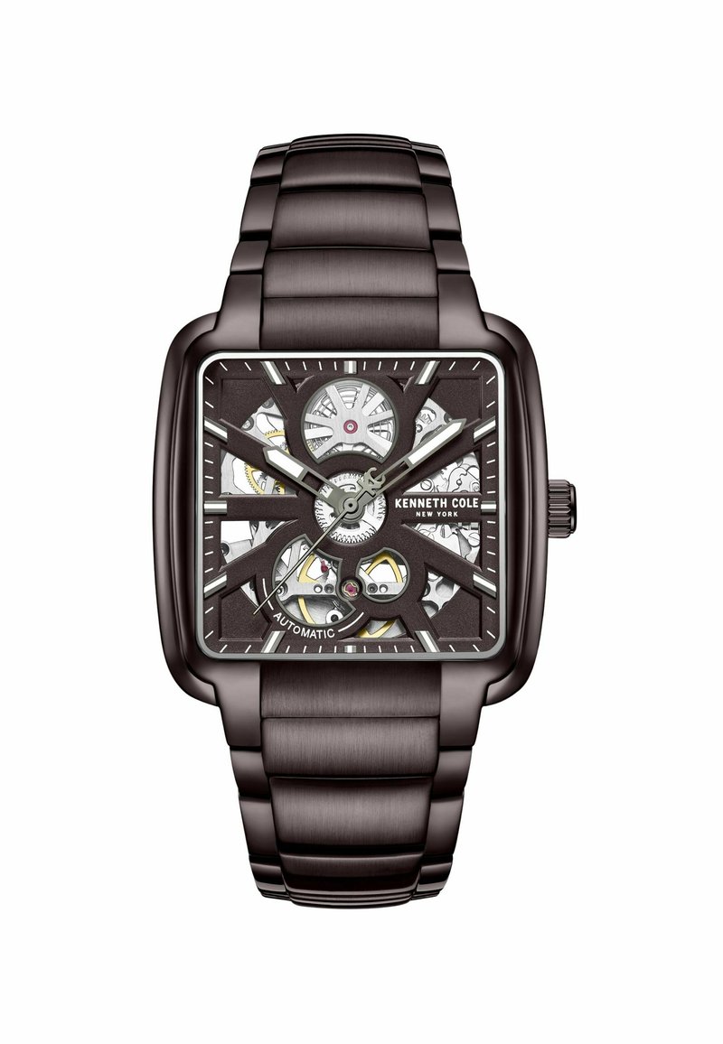 Quadratische Automatikuhr mit einem dunkelbraunen Metallarmband, offenes Ziffernblatt, das die komplexe Bewegung zeigt, silberne Akzente und Ziffernmarkierungen.