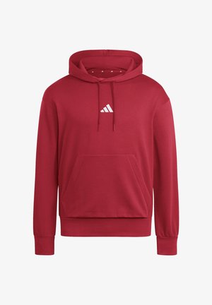 Czerwona bluza z kapturem, z przednią kangurzą kieszenią, regulowanym sznurkiem przy kapturze oraz małym białym logo Adidas umieszczonym na środku klatki piersiowej.