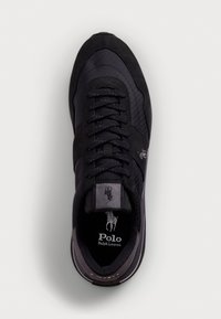 Black sneaker featuring a combination of textured suede and nylon, with lace-up closure and embossed logo on tongue. Rubber sole.