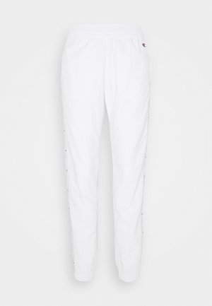 Pantalon de jogging blanc avec taille élastique, poches latérales, poignets élastiques et petit logo sur la hanche gauche haute.