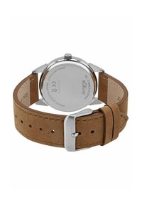 Brauner Wildleder-Uhrenarmband mit Gehäuse und Schließe aus silbernem Edelstahl. Die Rückseite zeigt Markendetails und den Aufdruck 'wasserabweisend'.