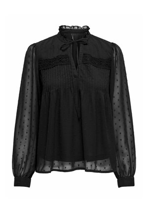 Blouse noire avec un col froncé et un détail à nouer. Fabriquée en tissu transparent avec des cœurs texturés et des accents plissés. Manches longues et froncées.
