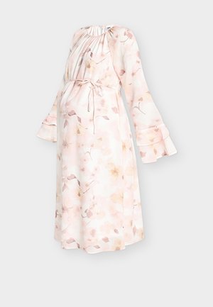 Graviditetkjole i mykt, lett stoff med et blomsterprint i lyse rosa og gullfarger, med lange ermer og belte med knyting for justerbar passform.