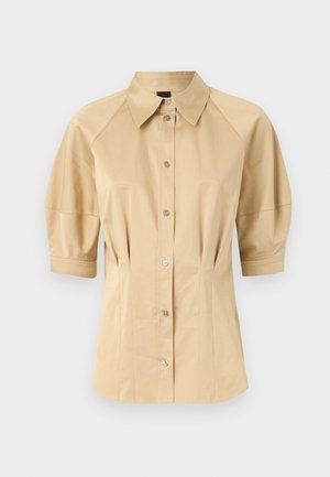 Beige button-up shirt with short puff sleeves, a spread collar, and seam detailing. Made of smooth fabric with front button closure.