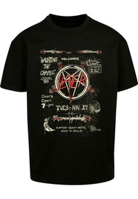 Black cotton t-shirt featuring a graphic design with red accents. Text includes "Slayer" and event details; distressed texture for a vintage look.