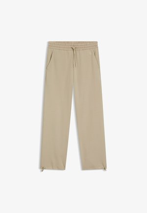 Jogger beige leggeri con vita elastica, chiusura con coulisse, due tasche laterali e dettagli con zip all'orlo.