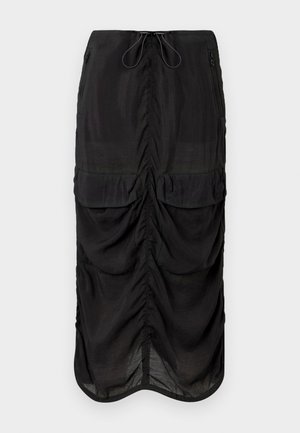Jupe noire en tissu léger. Présente des détails froncés, deux poches avant et une taille avec cordon de serrage pour un ajustement optimal.