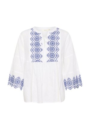 Blouse en coton blanc avec des motifs floraux brodés bleus, col rond, cordon de serrage et manches larges avec des accents en dentelle.