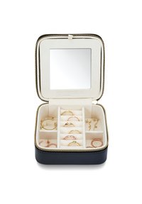 Black leather jewelry box with gold zipper, interior compartments lined in beige fabric, features rings and earrings, and a square mirror.