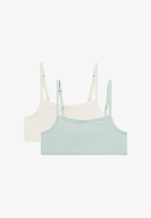 Zwei kurze Mädchencamisole-Tops mit verstellbaren Trägern, eines in Hellbeige und eines in Pastellblau, flach auf einem weißen Hintergrund ausgelegt.