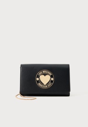 Black leather wallet with a gold circular logo featuring a heart. Includes a chain strap and a smooth texture with stitched edges.