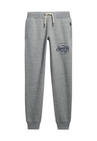 Pantalones de chándal grises hechos de una tela suave, con una cintura elástica y cordón, bolsillos laterales y un logo impreso en azul marino en una pierna.
