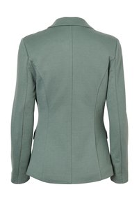 Op maat gemaakte blazer van zacht groene stof. Strak ontwerp met een uitgesneden kraag, lange mouwen en naaddetails. Geen zichtbare sluitingen.
